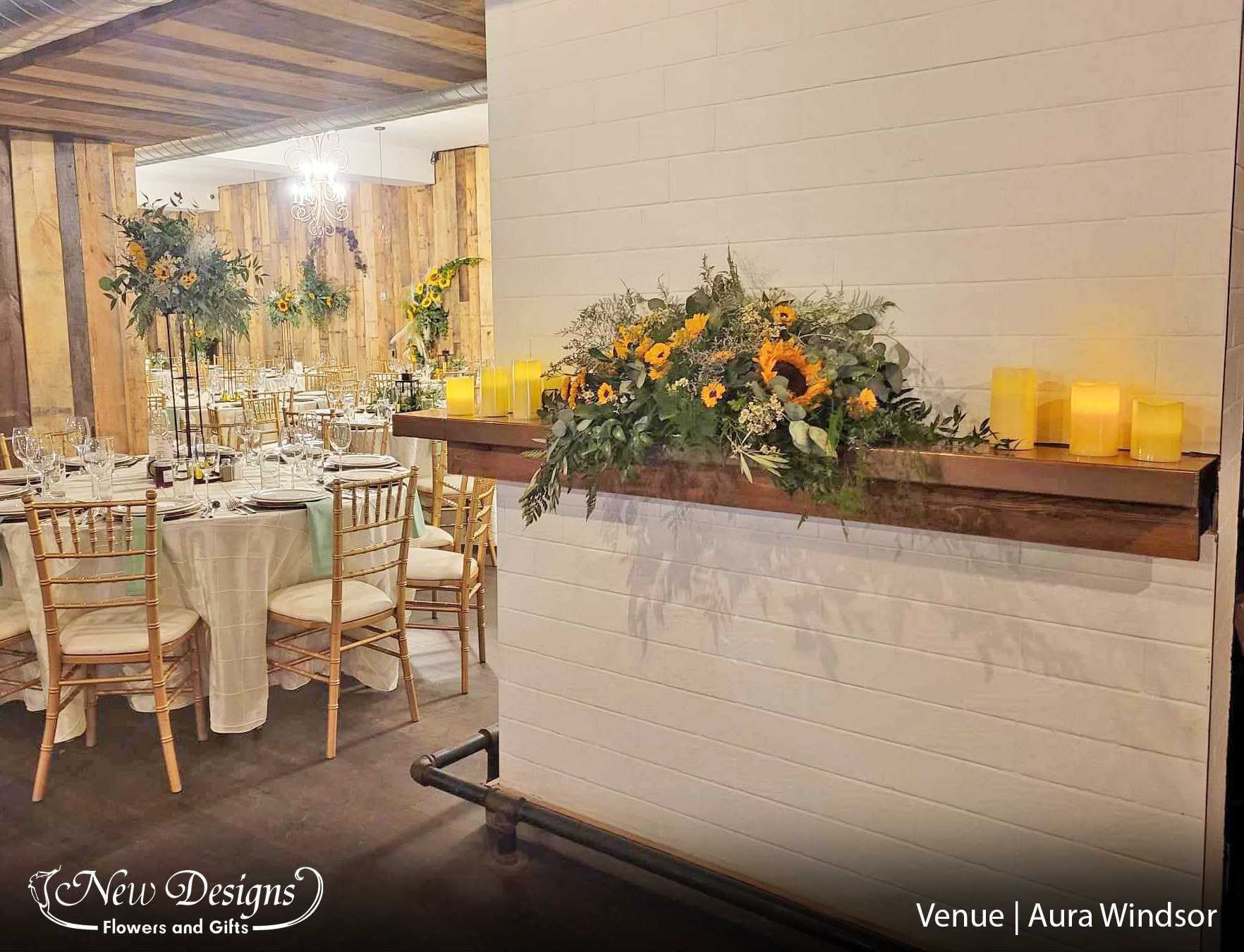 Gorgeous tall centerpieces of Sunflowers and greenery atop a tall 3 posted Iron Frame off set a stunning mantlepiece arrangement of large Sunflowers and wild greenery